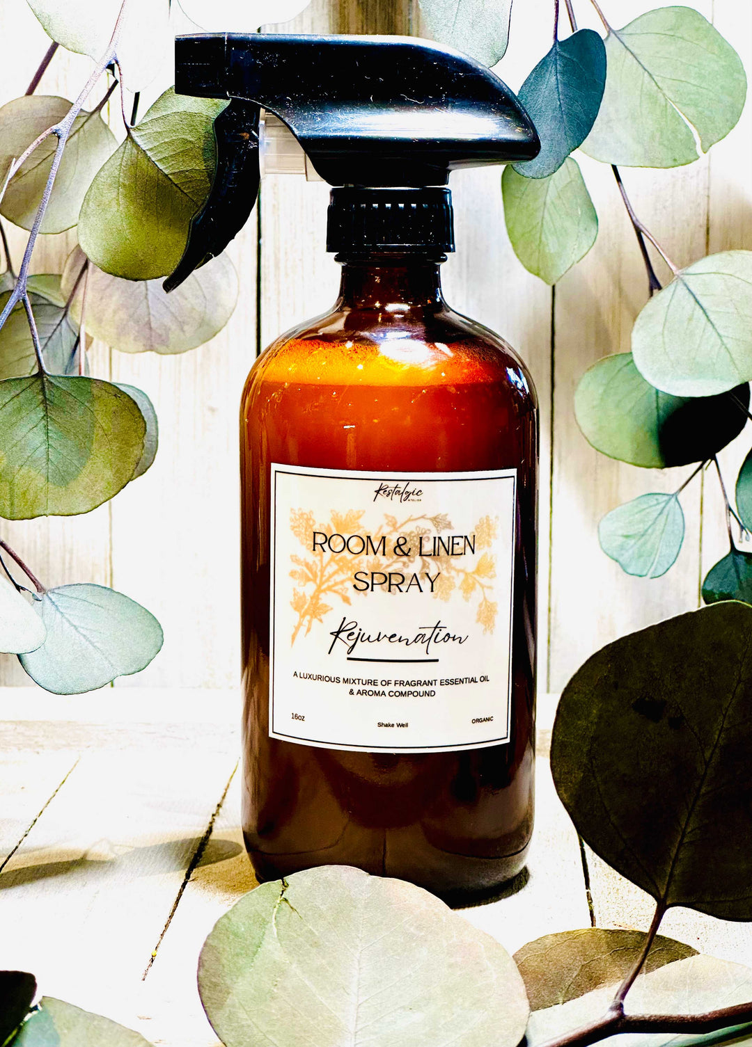 Amber glass room &amp; linen spray bottle with black trigger sprayer and Rejuvenation label