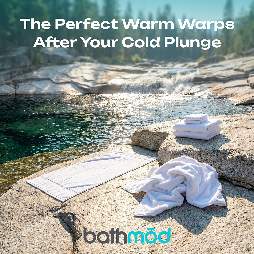 White bath towel set, folded towels stacked on stone beside a poolside surface