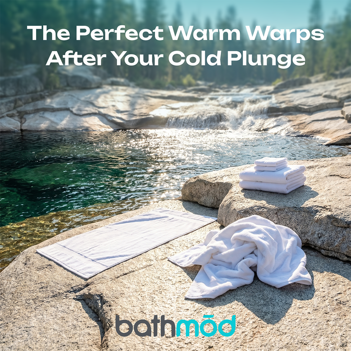 White bath towel set, folded towels stacked on stone beside a poolside surface