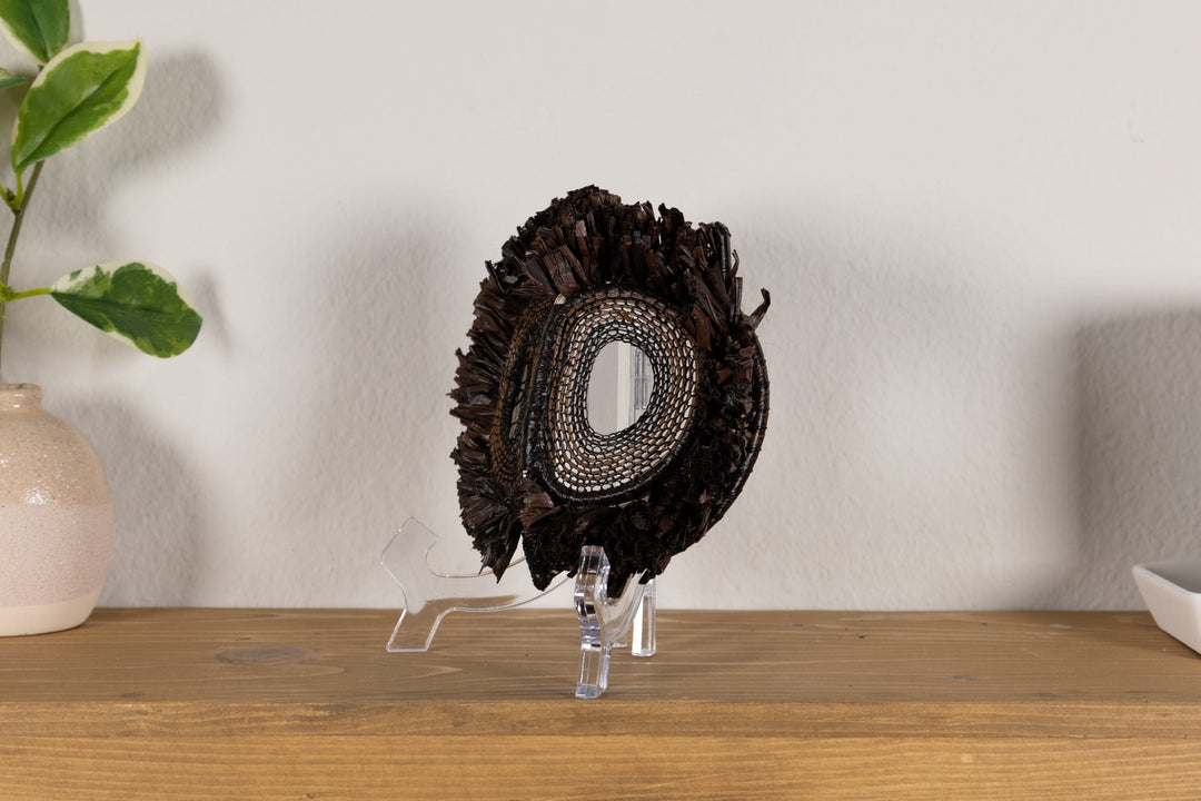 Fish-themed owlet mask in dark woven fringe with one oval mesh eye cutout