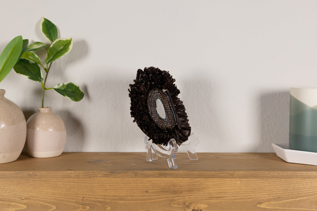 Fish-themed owlet decorative mask with dark woven fringe and one visible oval mesh eye cutout