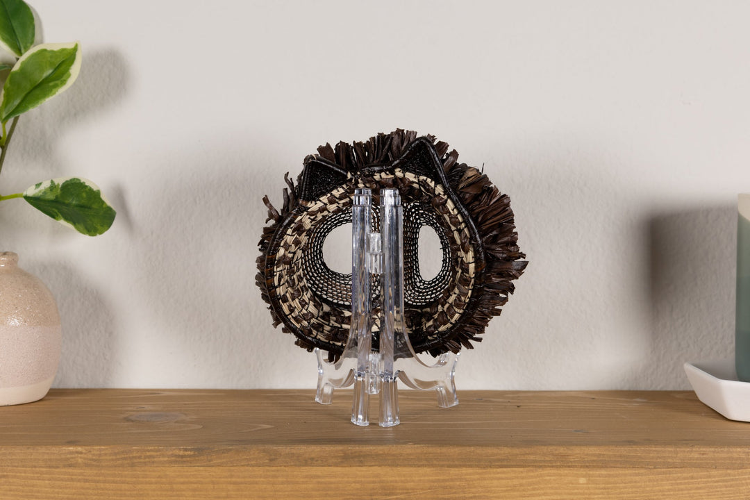 Fish-themed owlet mask back with dark woven fringe and two mesh eye openings