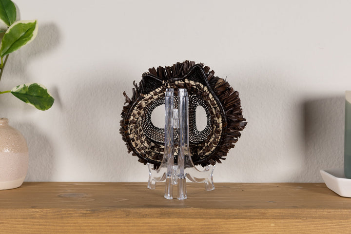 Fish-themed owlet mask back with dark woven fringe and two mesh eye openings