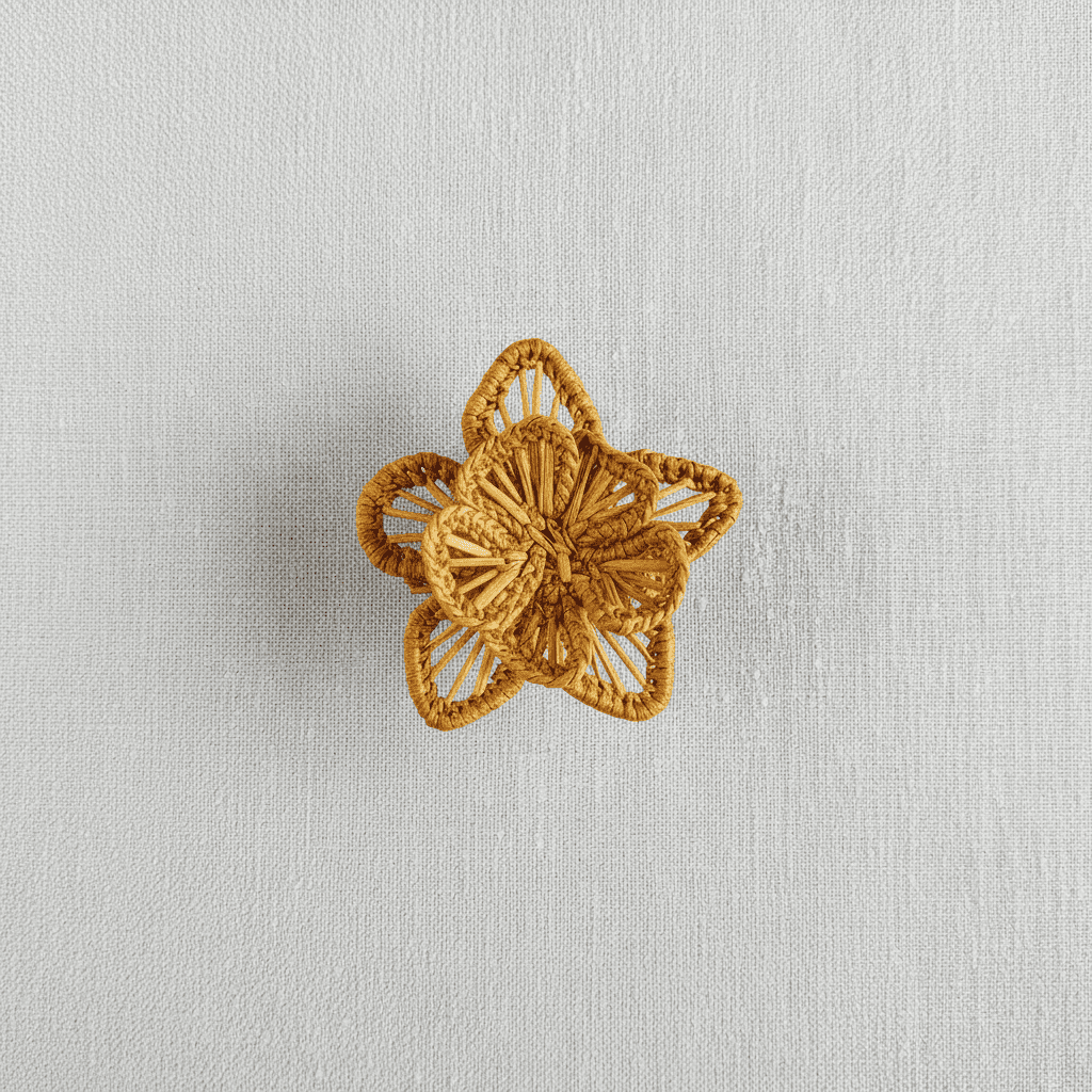 Handwoven star-flower napkin ring in light green woven palm fibers