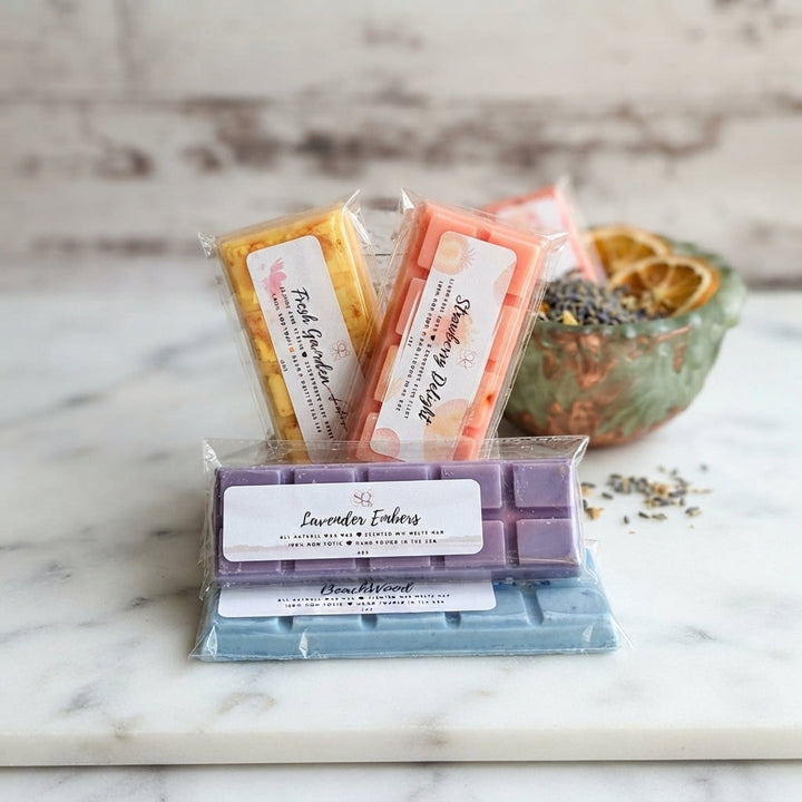 Seasonal assortment of wax melt bars in pastel colors inside a clear wrap
