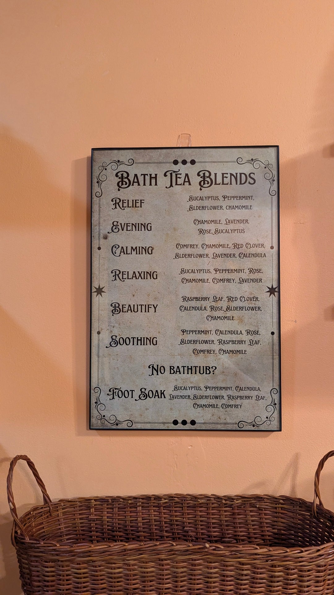 Framed poster listing bath tea blends with a &
