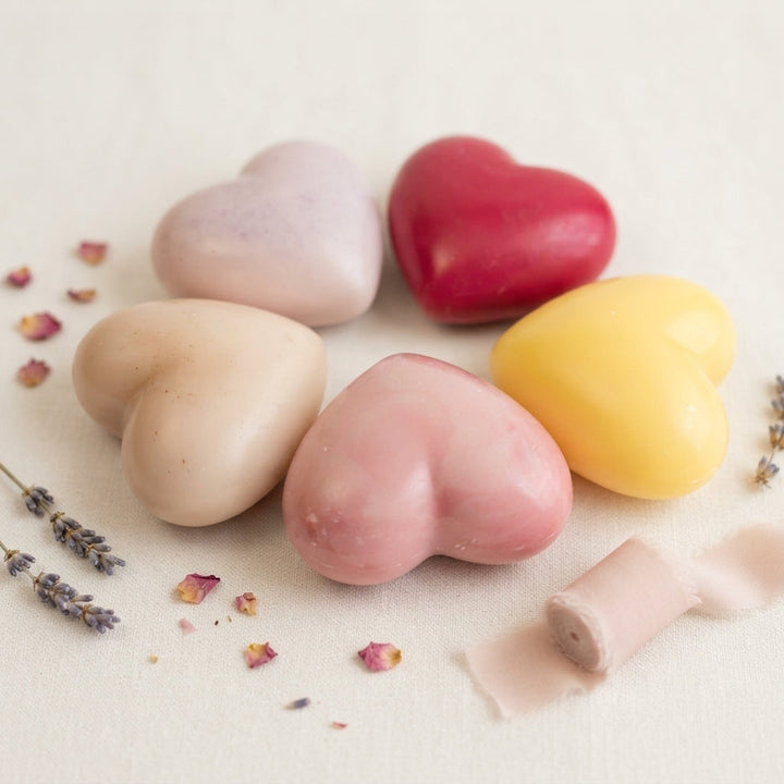 Assorted pastel heart wax fresheners on a light surface