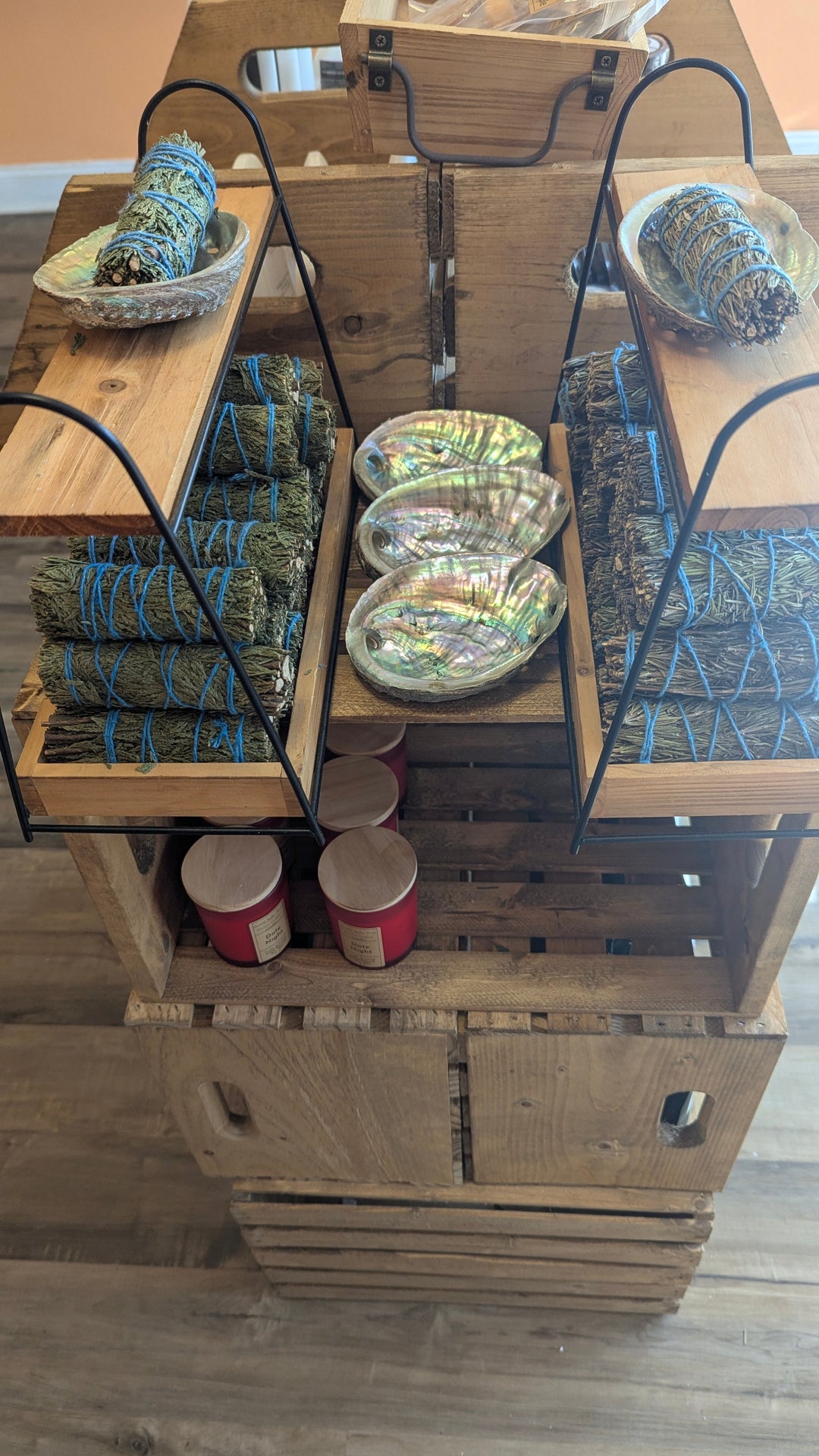 Abalone shell display set with round iridescent shell dishes on metal racks