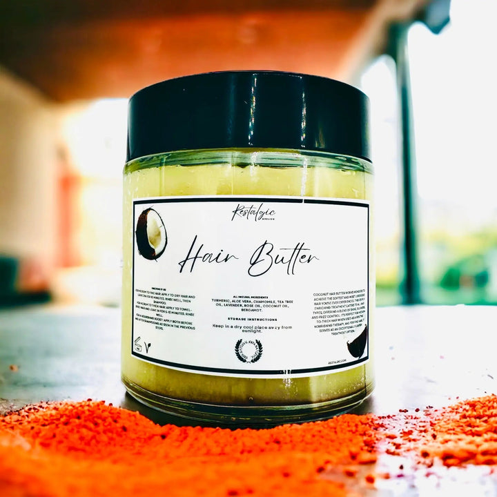 Hair butter jar with black lid and yellow-green cream, front label with ingredient details