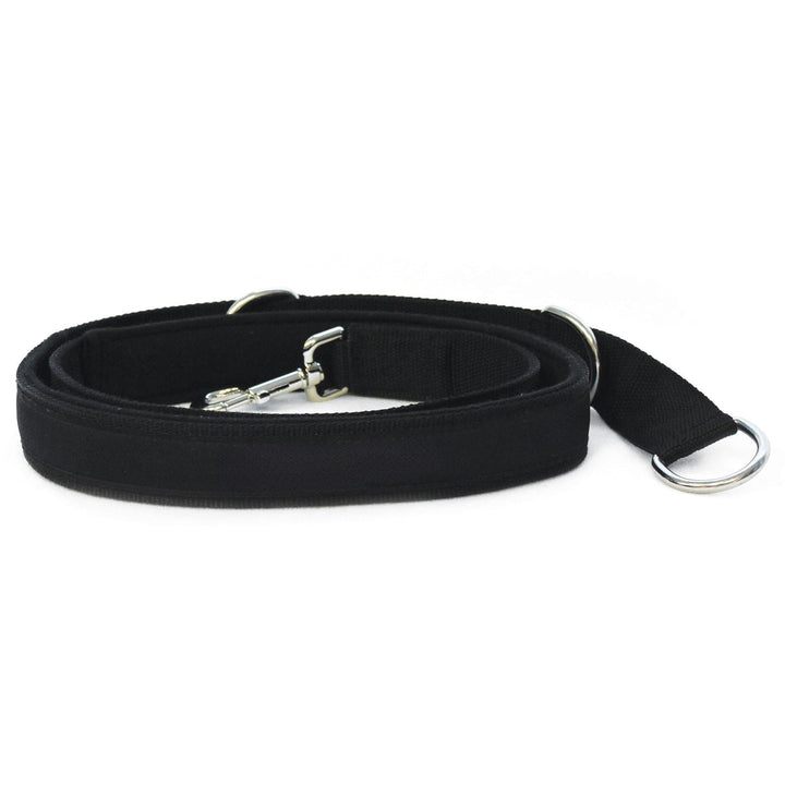 Black adjustable foot strap with metal buckle and D-ring for reformer use