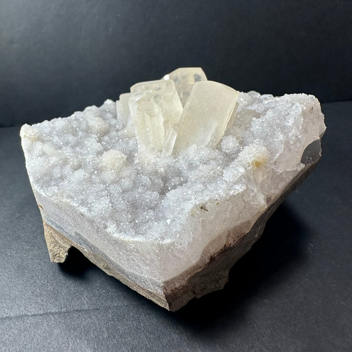 Calcite crystal cluster on agate with sparkling white druzy coating, pale translucent points
