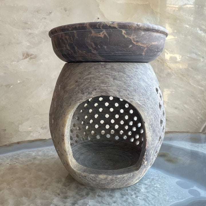 Carved soapstone essential oil burner with small dotted cutout, dark brown