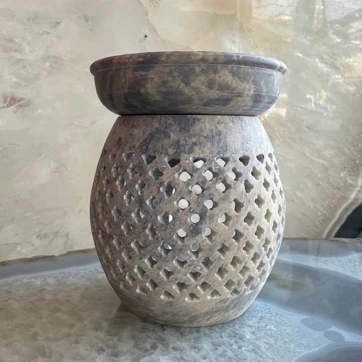 Carved soapstone essential oil burner with perforated diamond cutouts, dark brown