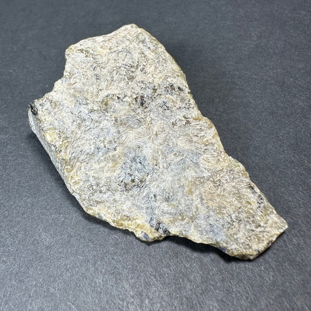 Labradorite rough stone, thick irregular chunk with mostly pale gray texture