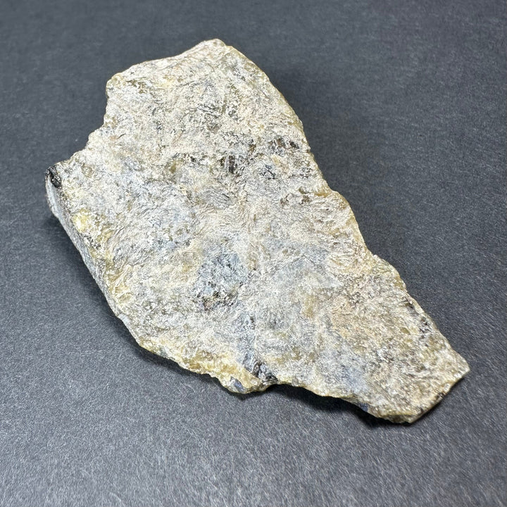 Labradorite rough stone, thick irregular chunk with mostly pale gray texture