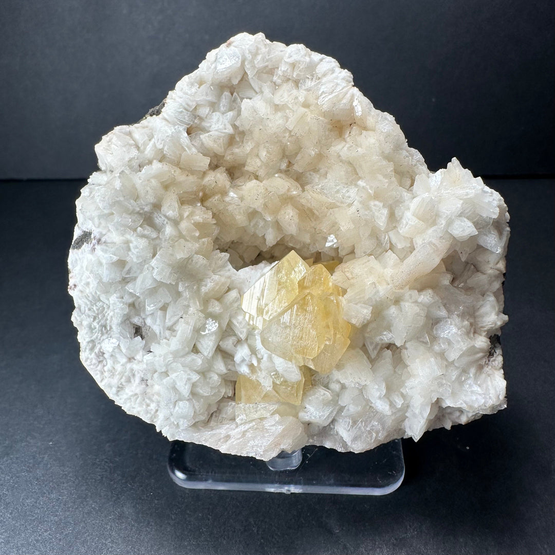 Yellow powellite and heulandite mineral specimen, white crystals with yellow center