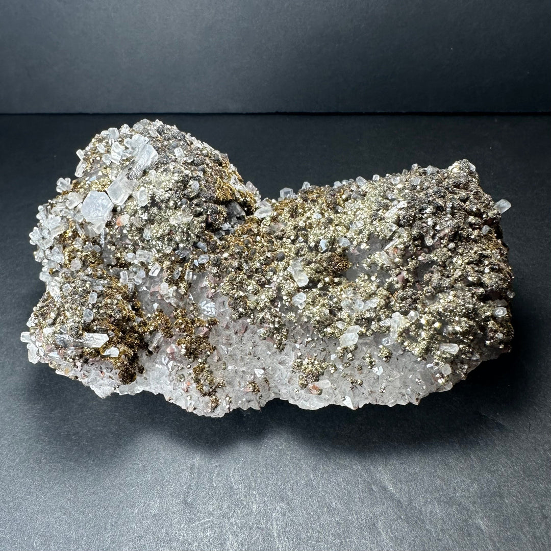 Marcasite on calcite mineral specimen with gold-toned and clear crystalline clusters