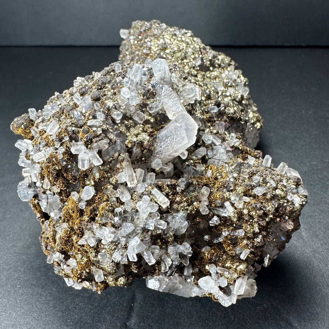Marcasite on calcite mineral specimen, dense gold sparkle with clear crystal shards