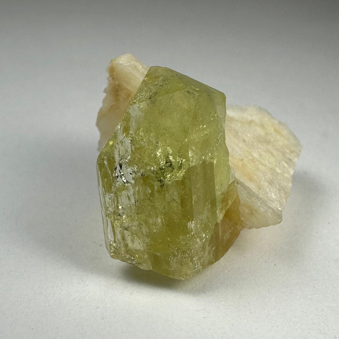 Green Brazilianite crystal with white Albite, rough faceted specimen
