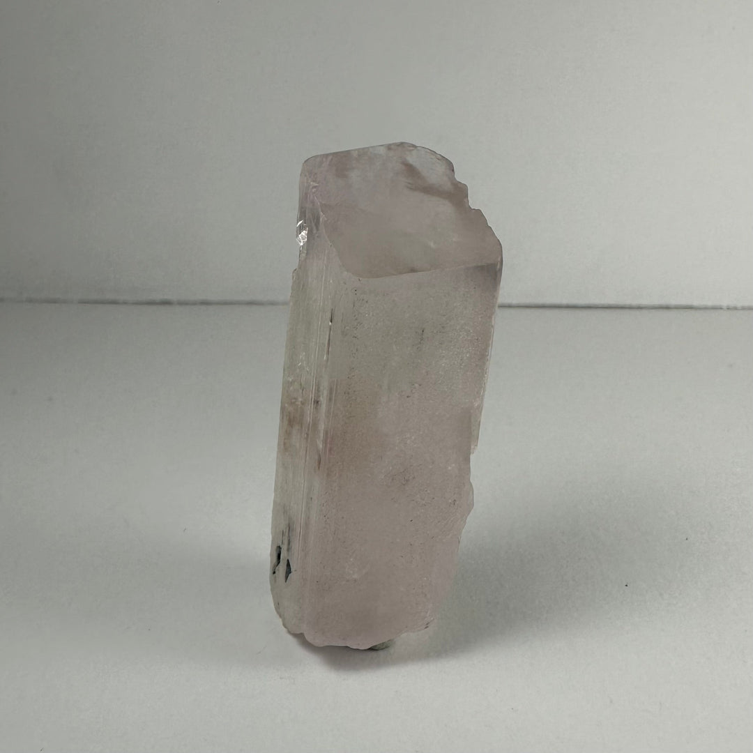 Terminated light pink kunzite crystal, rounded top, translucent prismatic body