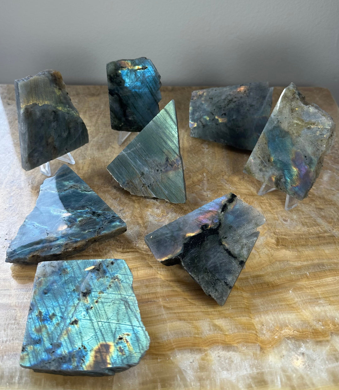 Assorted polished labradorite slabs with glossy one-side finish and dark gray-blue tones