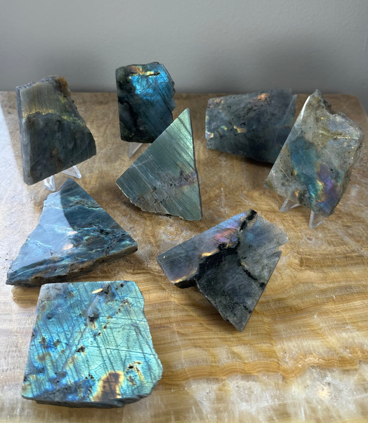 Assorted polished labradorite slabs with glossy one-side finish and dark gray-blue tones
