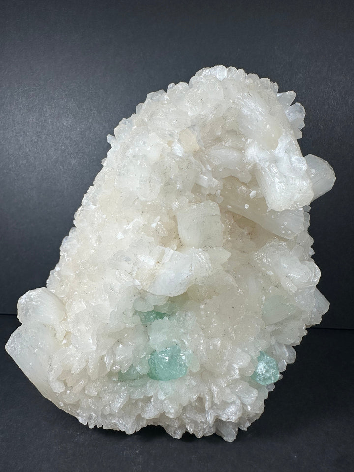 White druzy crystal cluster with pale green accents on matrix base