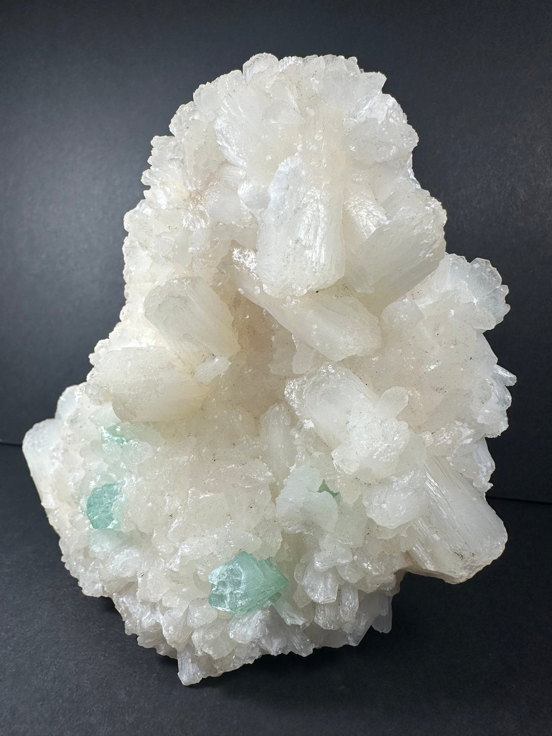 White mineral cluster with pale green apophyllite on crystal matrix