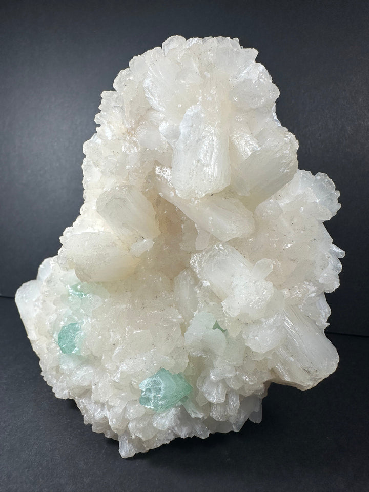 White mineral cluster with pale green apophyllite on crystal matrix