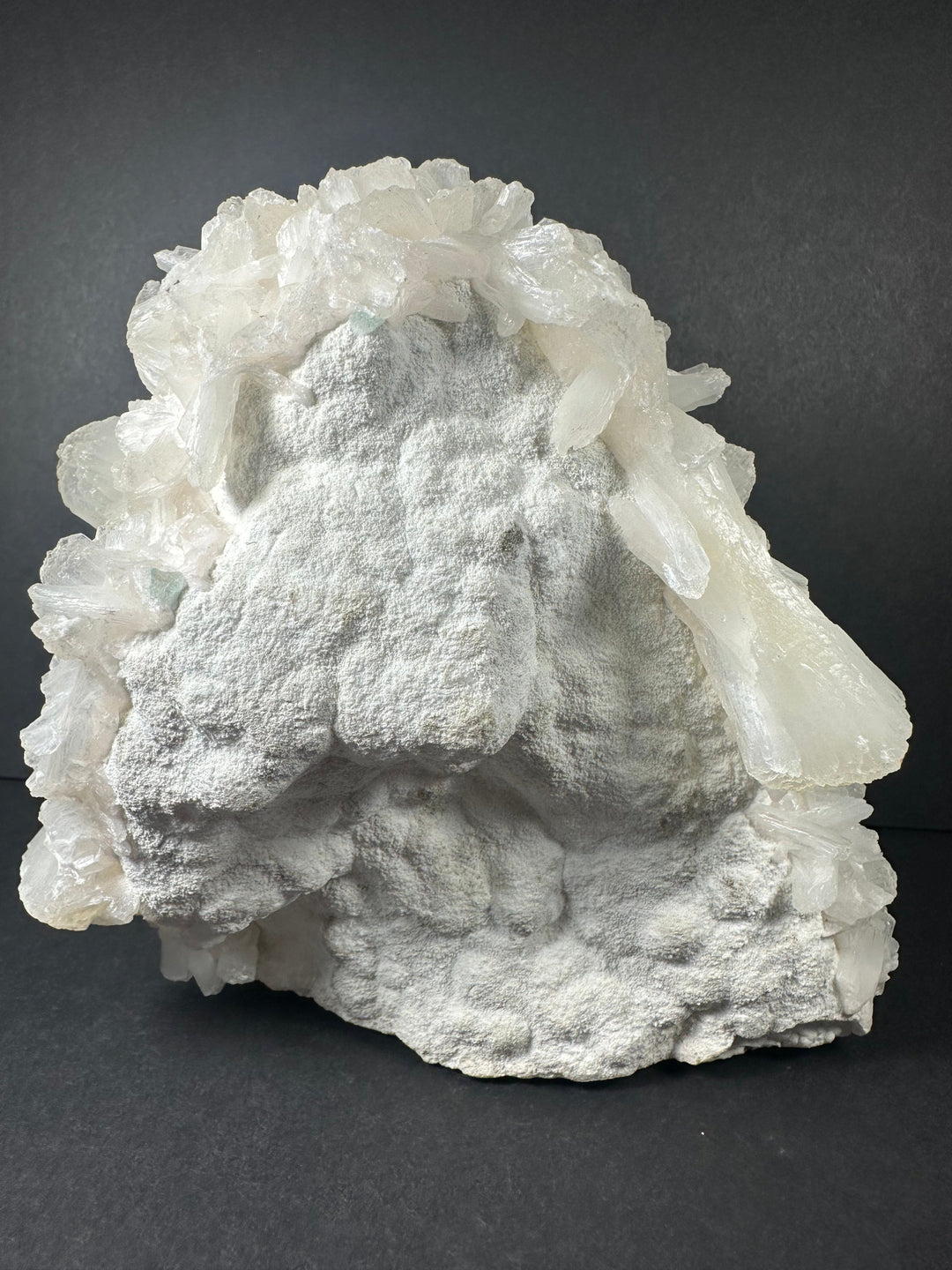 Silvery white mineral crust with white crystal blades and pale green flecks