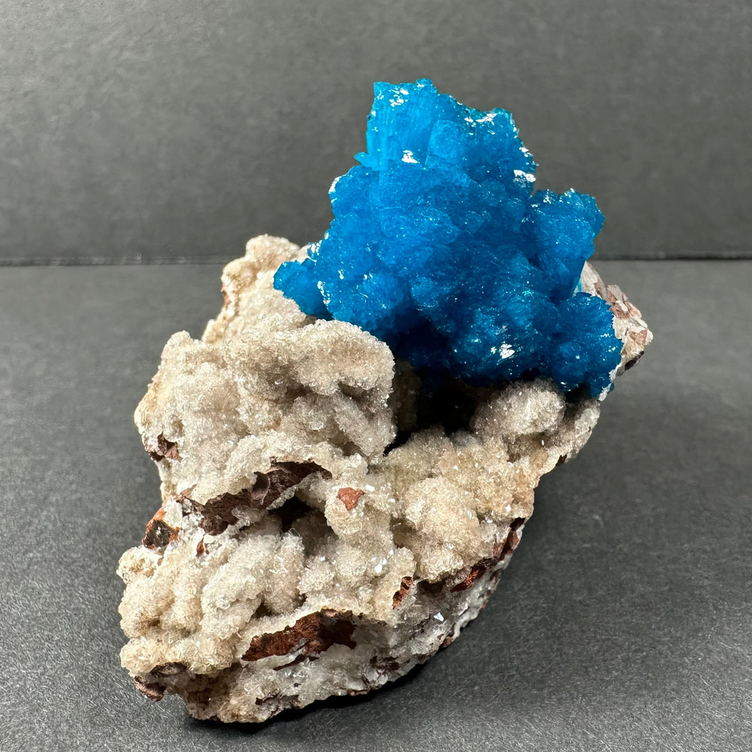 Blue cavansite crystal formation on tan-beige stilbite matrix, compact specimen