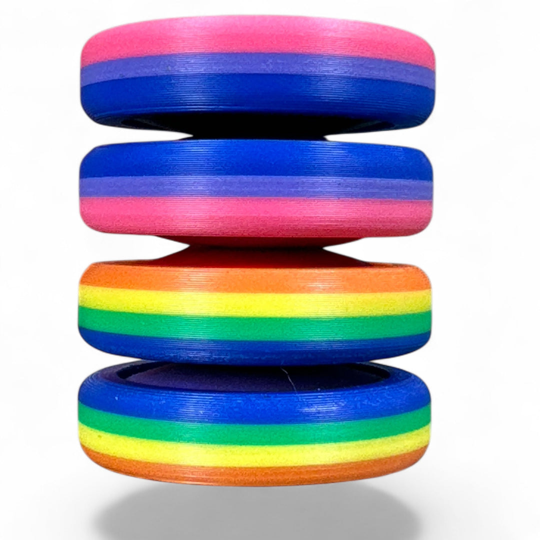 Pride Moons multi-layer oval discs with pink, blue, and orange stripes