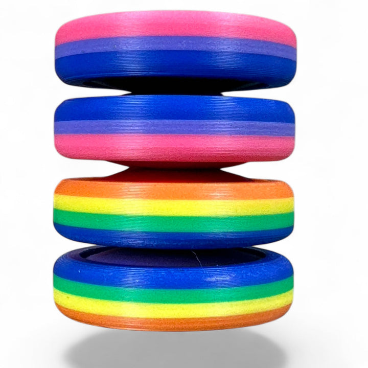 Pride Moons multi-layer oval discs with pink, blue, and orange stripes