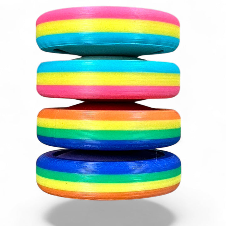 Pride Moons stack of rainbow striped oval discs in three layers