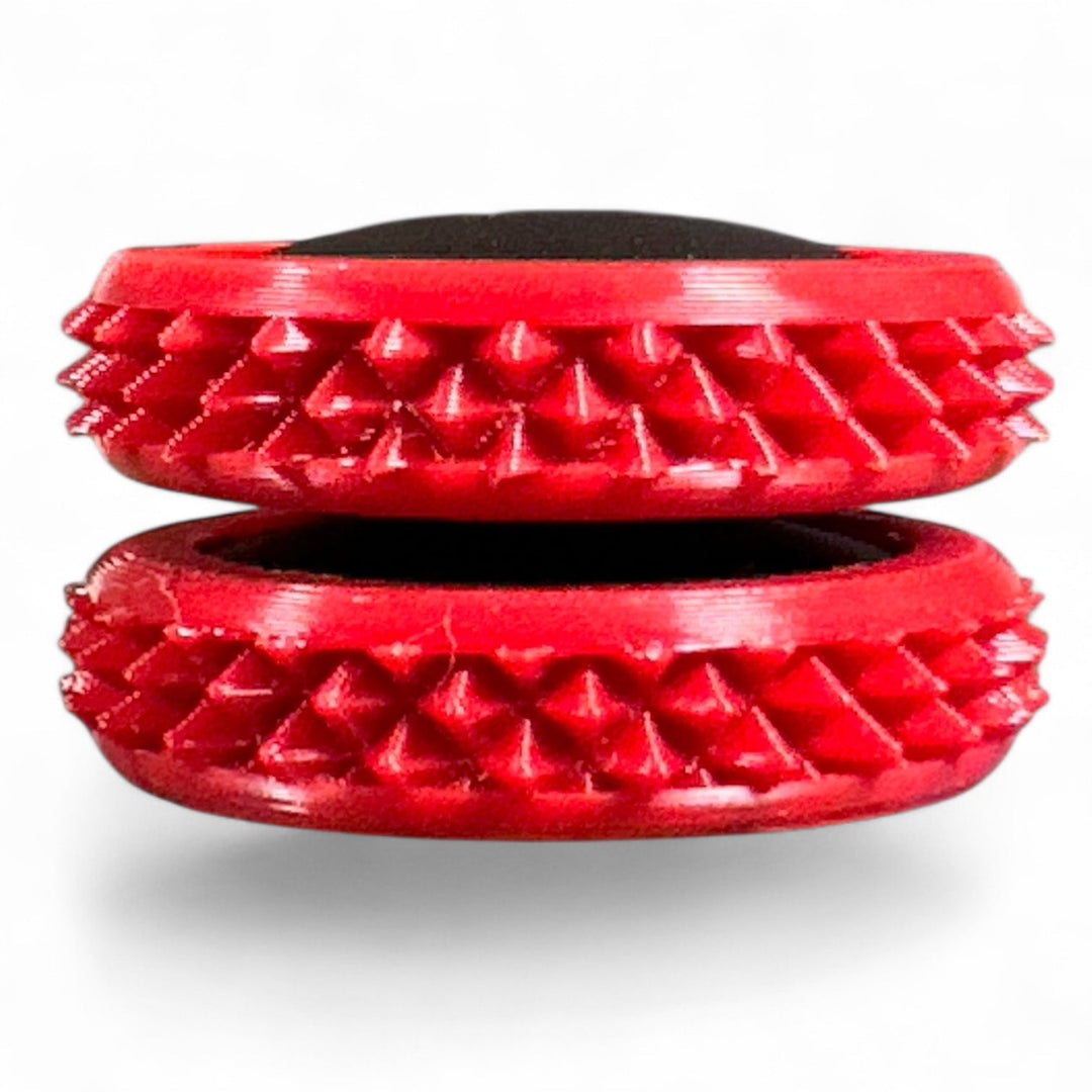 Red spiky fidget gear discs with oval opening and textured gear ring