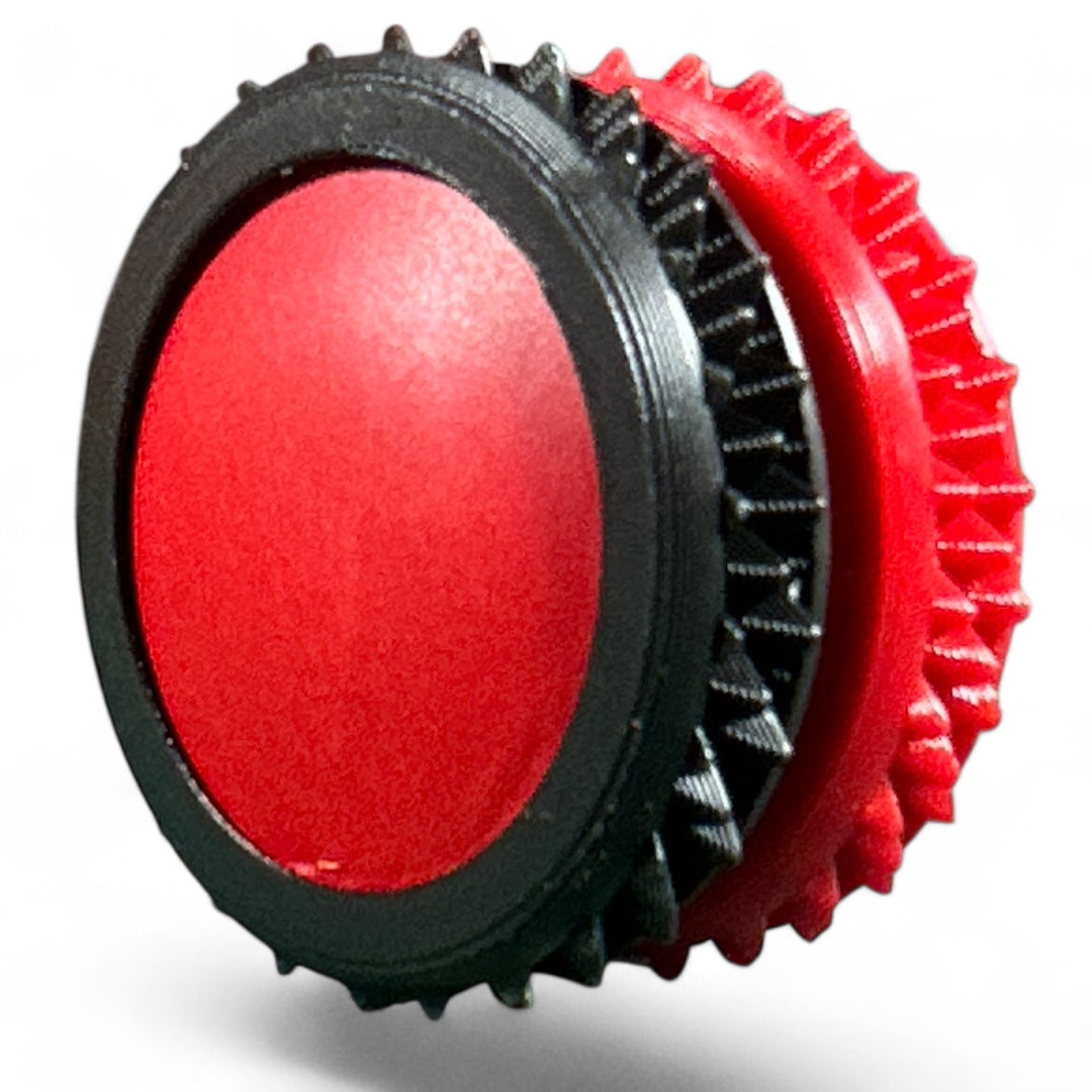 Black and red fidget gear with spiky rings and oval center pads