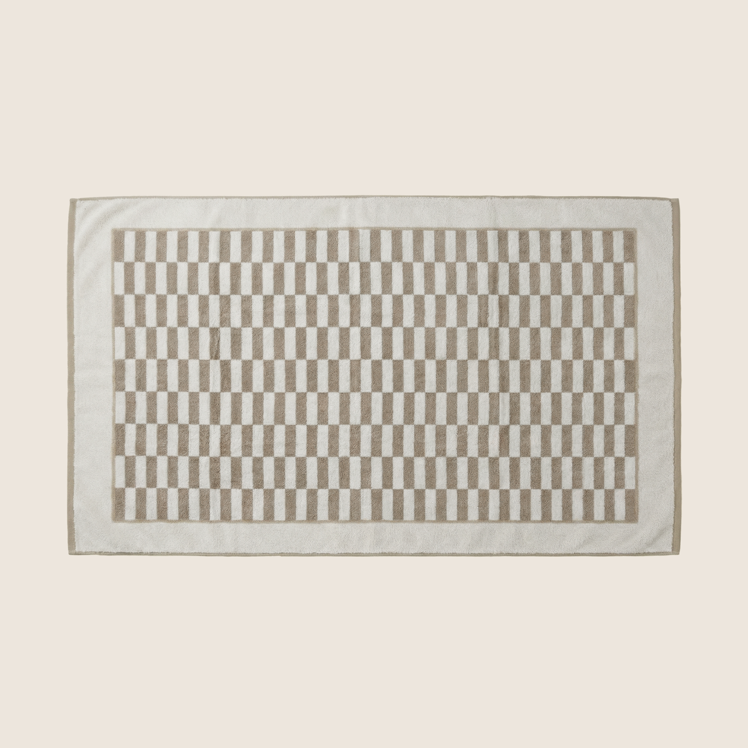 Rectangle bath towel with beige and white checkered panel and light gray border