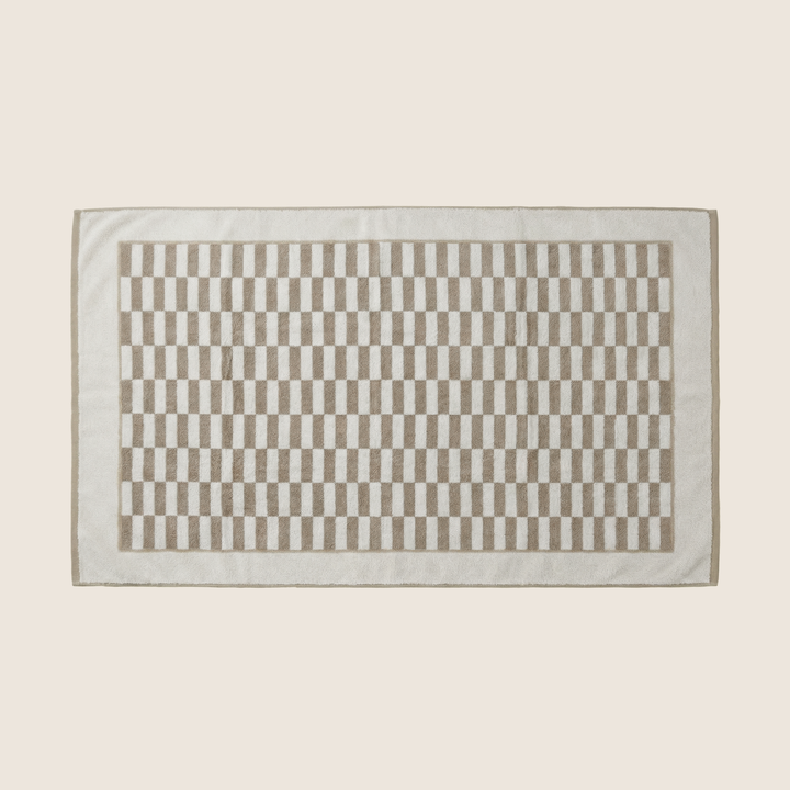 Rectangle bath towel with beige and white checkered panel and light gray border