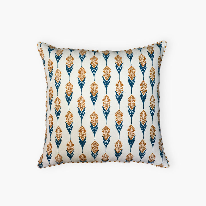 Throw pillow cover with vertical teardrop floral pattern in ginger, blue, and cream