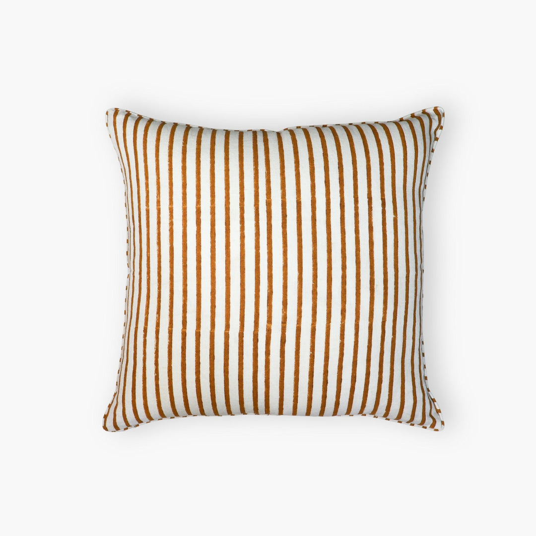 Throw pillow cover with vertical brown stripes on a white fabric background