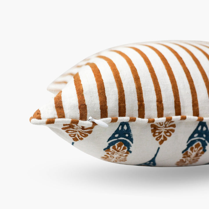 Throw pillow cover with white and brown vertical stripes plus blue teardrop motifs