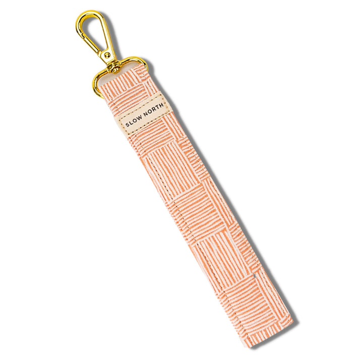 Pink striped wristlet keychain with gold clasp and lobster hook