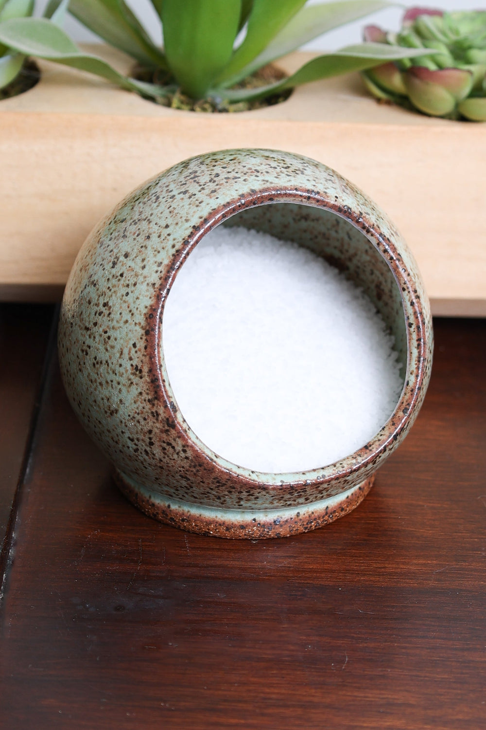 Handmade stoneware salt cellar, speckled light green exterior, open round top