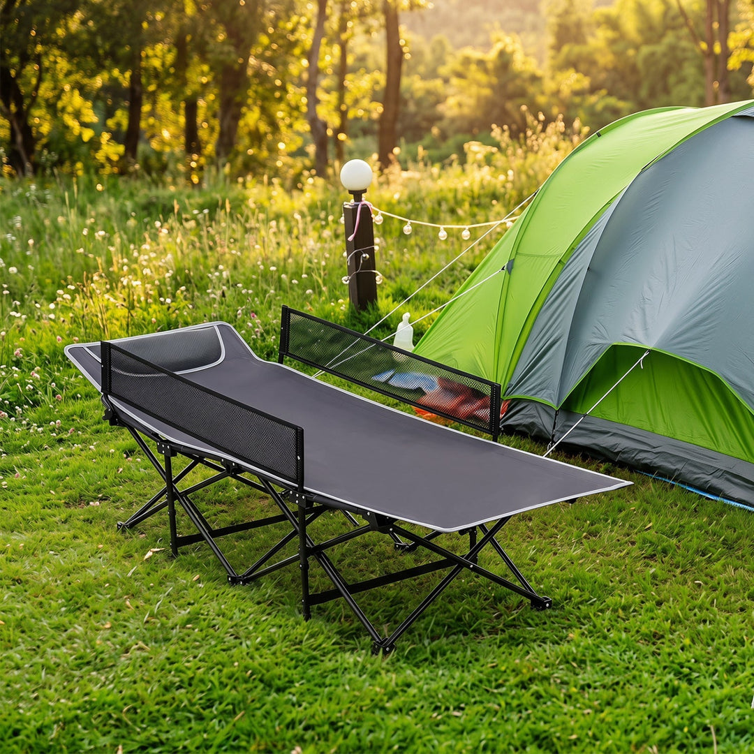 Navy folding camping cot with padded headrest and guardrail, black steel frame