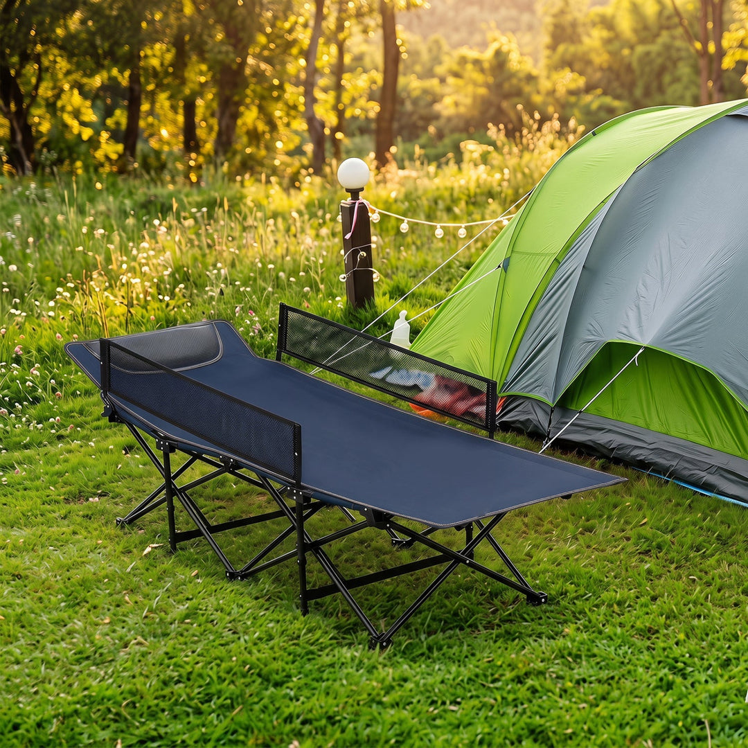 Navy folding camping cot with padded headrest and guardrail, black steel legs