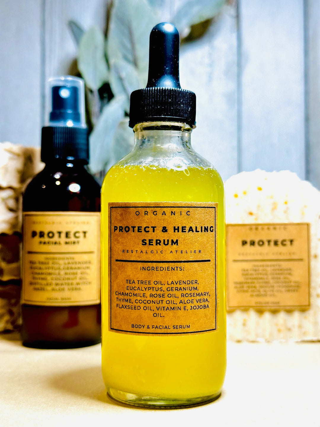 Protect &amp; Healing serum bottle with dropper, amber-yellow liquid