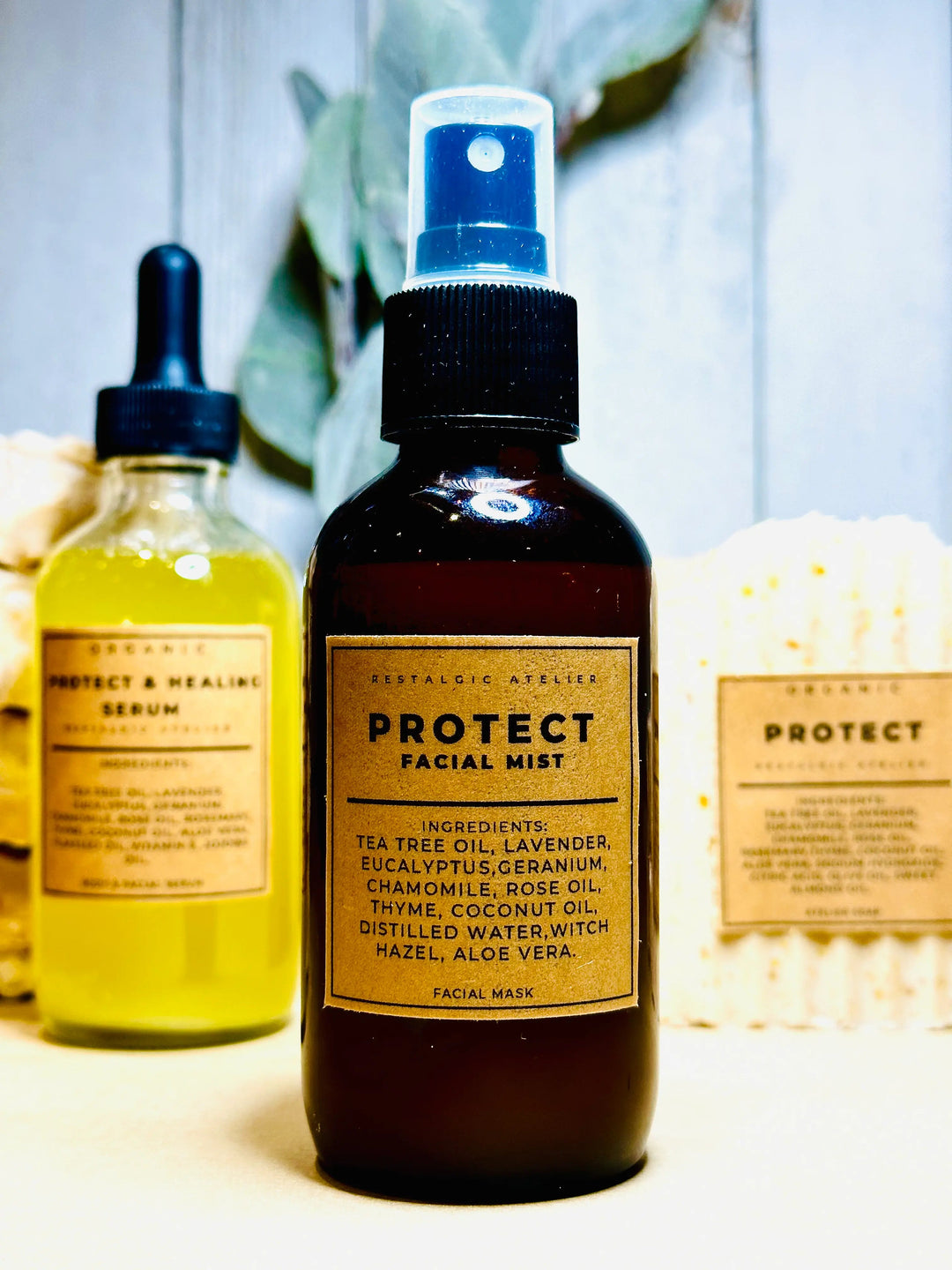 Protect facial mist bottle with blue spray cap, dark amber liquid