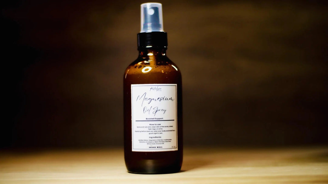 Facial mist spray bottle with silver pump, amber liquid, "Magnesium" label