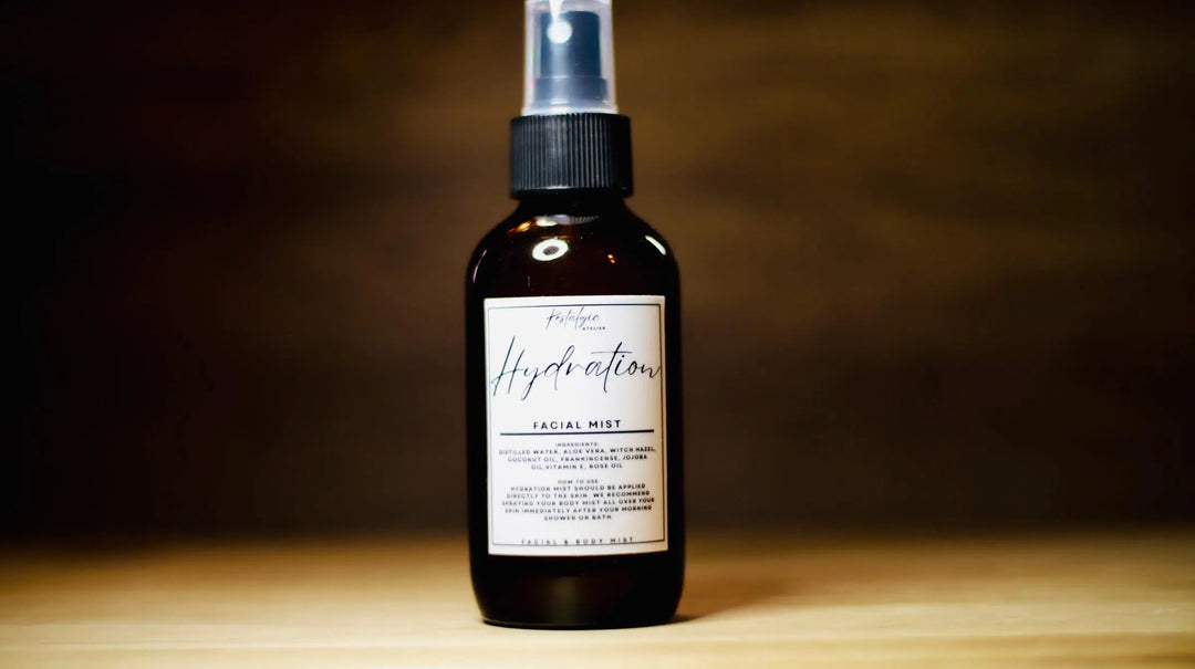 Hydration facial mist spray bottle with silver pump, dark amber liquid, white label