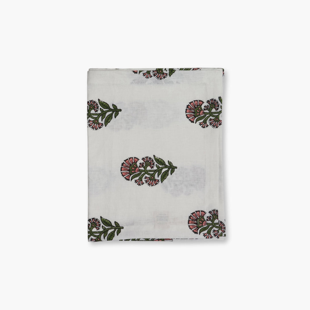 Linen hand-printed runner with scattered floral motifs on a light background